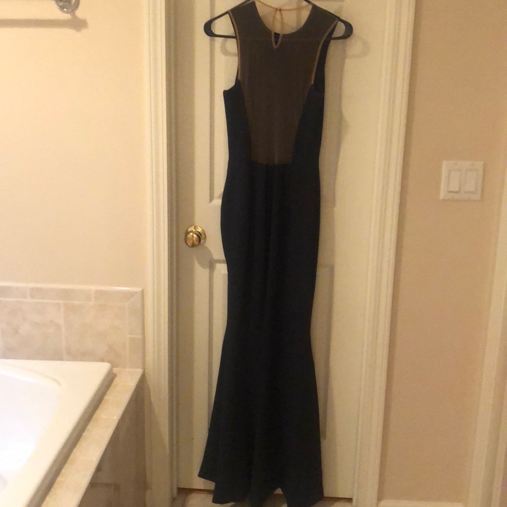 Evening  gowned. Transparent back. Never worn.